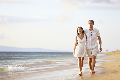 Couple walking along the beach